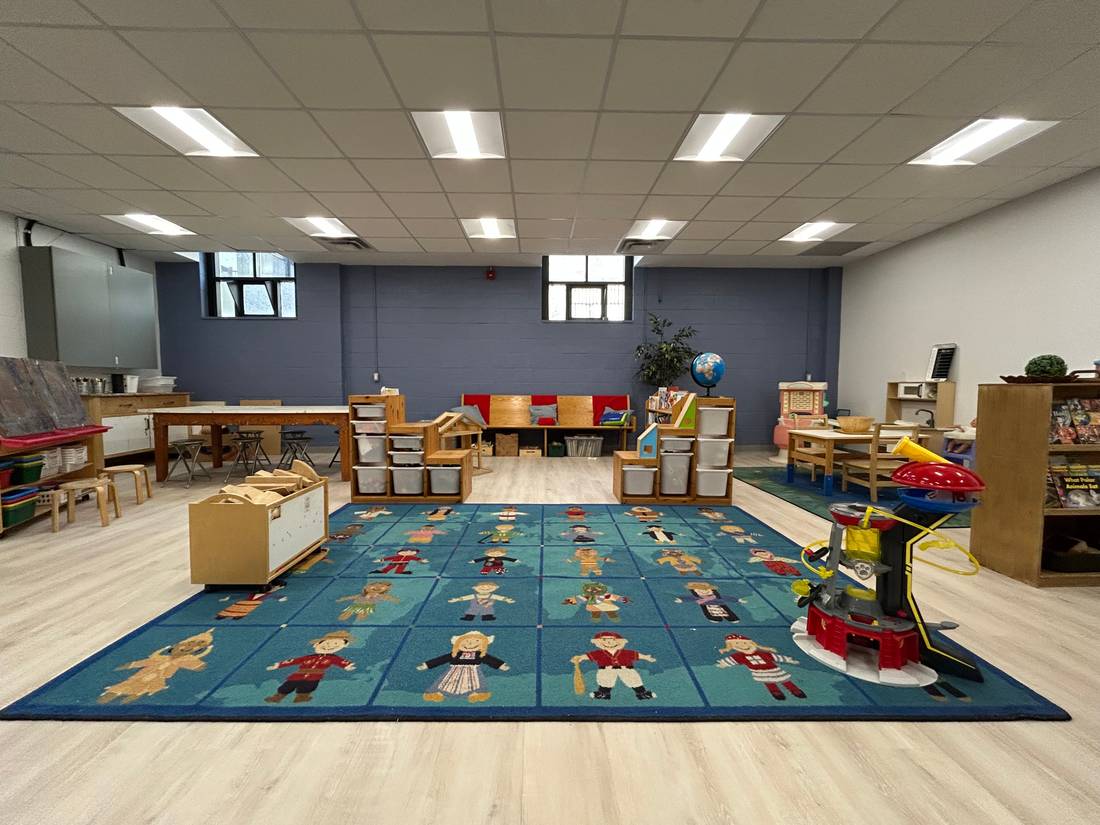 Bright classroom with carpet play area