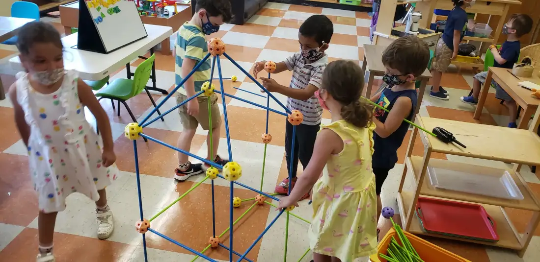 Children building a geometric structure together